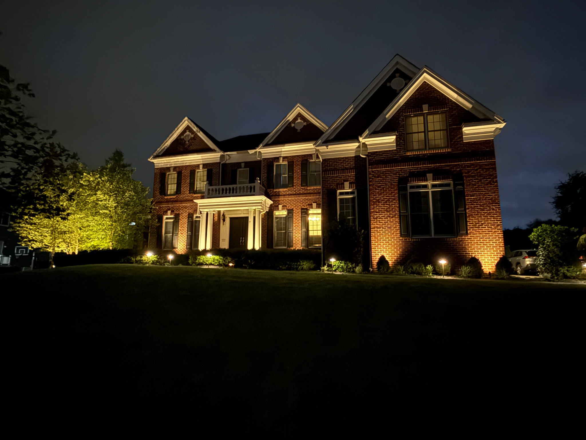 Warm architectural lighting highlights a Garden State residential project